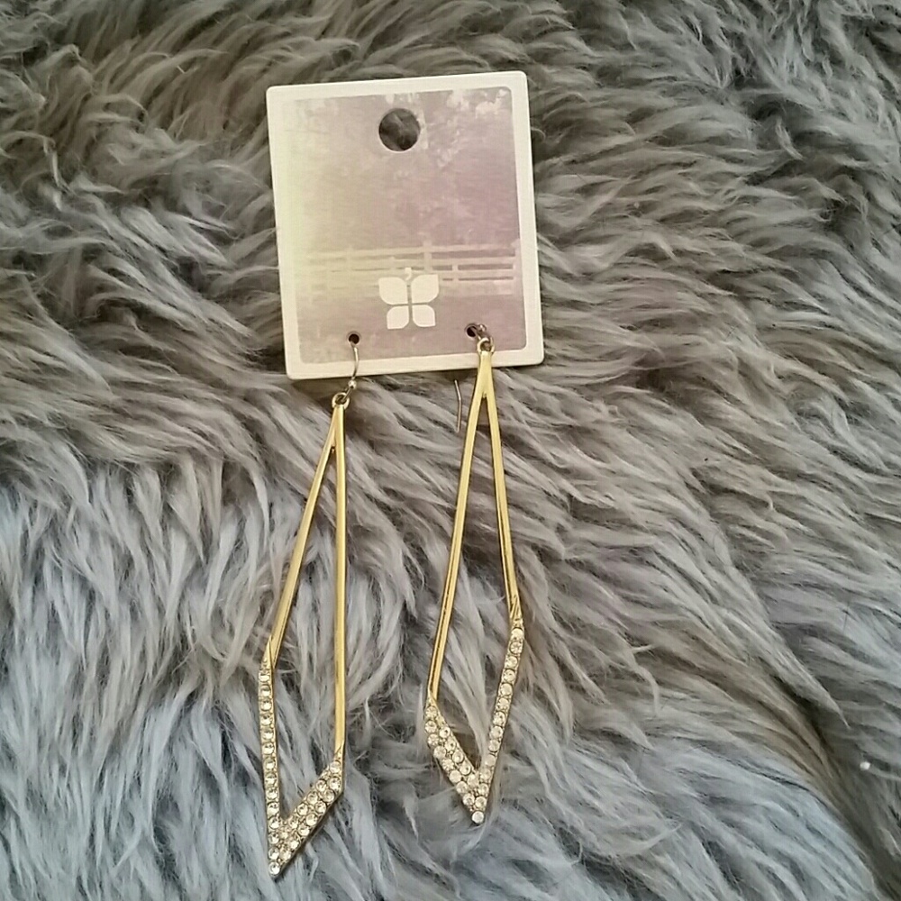 Gold earrings.